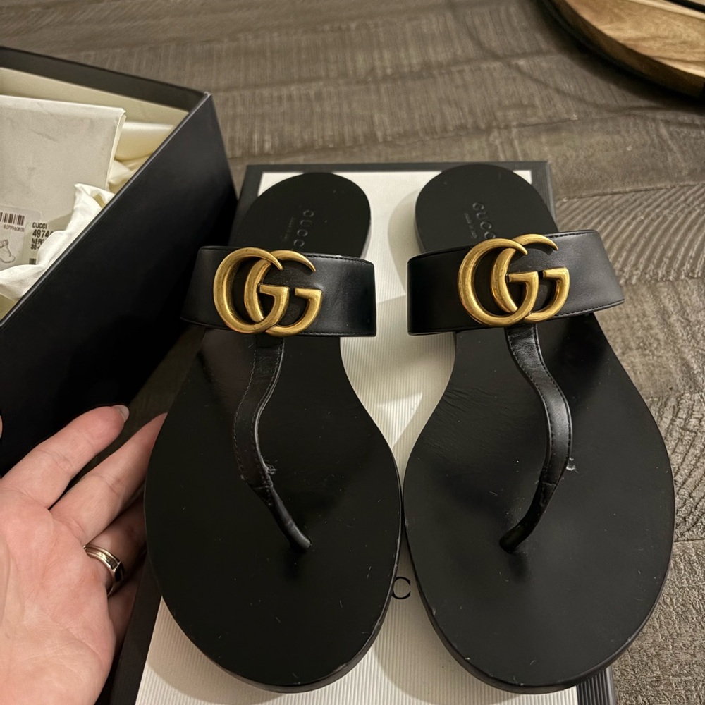 Gucci Black Flip Flops with Gold Emblem